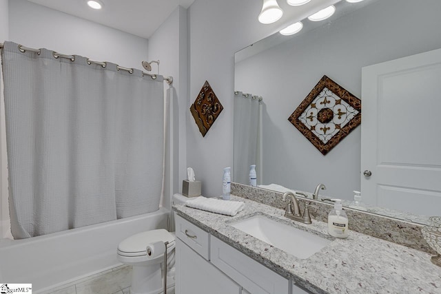 bathroom featuring shower / tub combo, toilet, and vanity