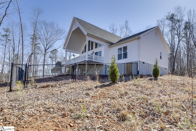 view of side of property featuring fence