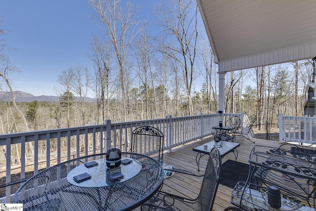 wooden deck with outdoor dining space