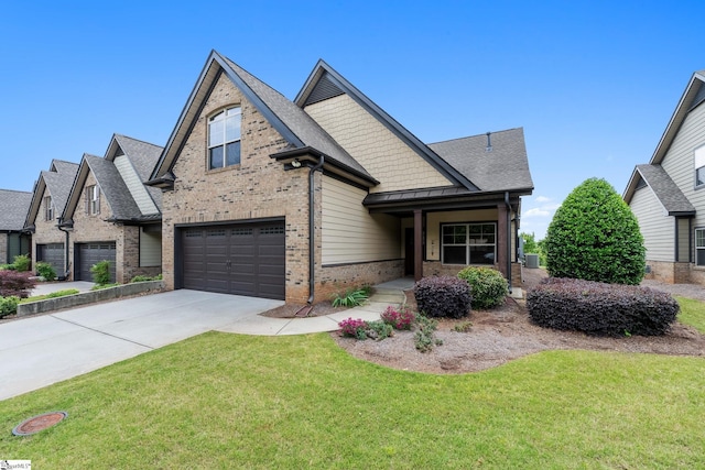 view of front of house with brick siding, driveway, a front lawn, a garage, and a standing seam roof