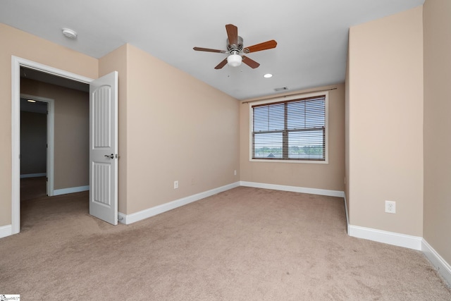 carpeted spare room featuring ceiling fan, baseboards, recessed lighting, and a smoke detector