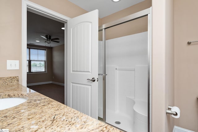 bathroom featuring an enclosed shower, a ceiling fan, recessed lighting, vanity, and baseboards