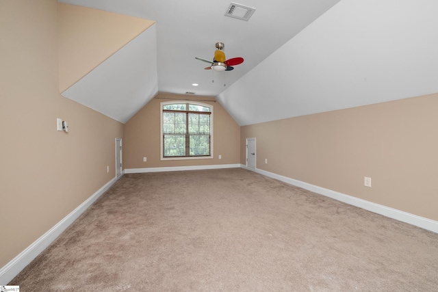 bonus room with lofted ceiling, carpet flooring, baseboards, and ceiling fan