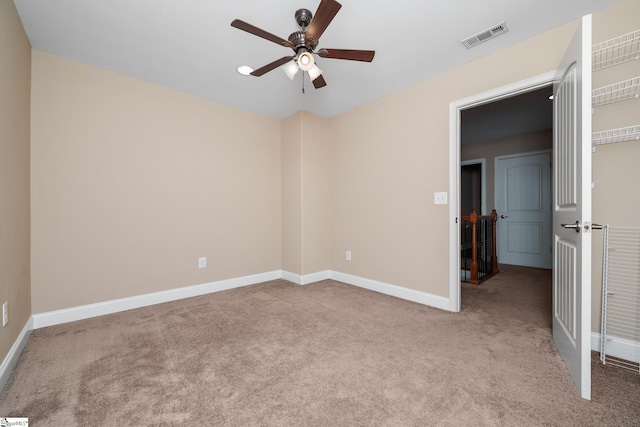 unfurnished bedroom featuring carpet, baseboards, and ceiling fan