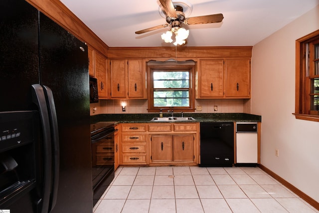 200 Lavonne Ave, Easley, SC 29642 - kitchen with black appliances, a sink, dark countertops, ceiling fan, and brown cabinets