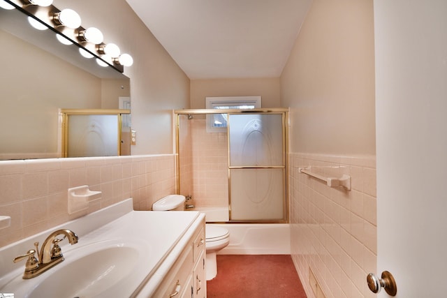 200 Lavonne Ave, Easley, SC 29642 - full bathroom with tile walls, toilet, vanity, enclosed tub / shower combo, and a wainscoted wall