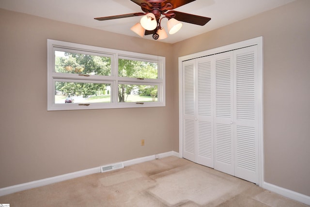 200 Lavonne Ave, Easley, SC 29642 - unfurnished bedroom featuring light carpet, baseboards, a closet, and a ceiling fan