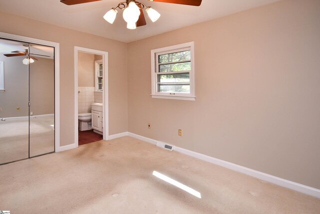 200 Lavonne Ave, Easley, SC 29642 - unfurnished bedroom featuring carpet floors, ensuite bathroom, a closet, ceiling fan, and baseboards