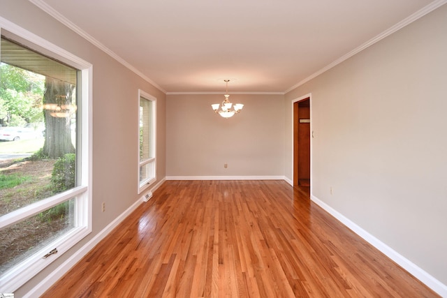 200 Lavonne Ave, Easley, SC 29642 - empty room with a chandelier, healthy amount of natural light, light wood-style floors, and crown molding