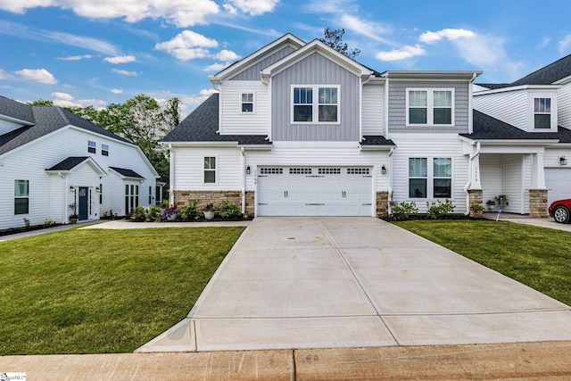1560 Shallons Ct, Spartanburg, SC 29301 - view of front of property with stone siding, a front yard, driveway, and an attached garage