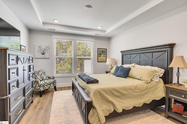 1560 Shallons Ct, Spartanburg, SC 29301 - bedroom featuring light wood-style floors, a tray ceiling, baseboards, and recessed lighting