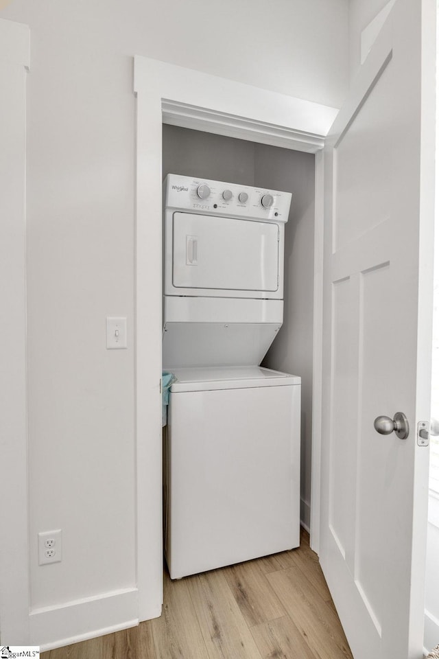 1560 Shallons Ct, Spartanburg, SC 29301 - laundry room featuring stacked washer / dryer and light wood-style flooring