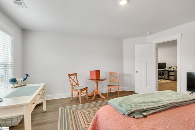 1560 Shallons Ct, Spartanburg, SC 29301 - bedroom featuring an office area, wood finished floors, and baseboards