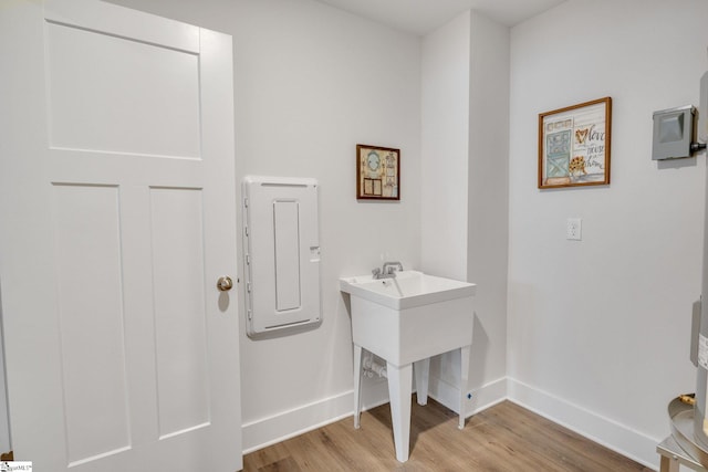 1560 Shallons Ct, Spartanburg, SC 29301 - laundry room with light wood-style floors, baseboards, and electric panel