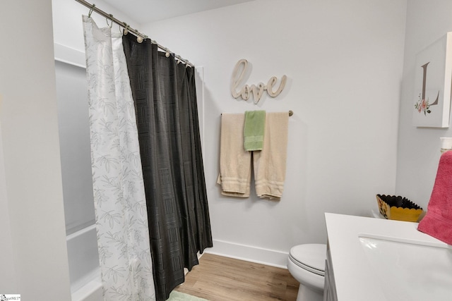 1560 Shallons Ct, Spartanburg, SC 29301 - full bathroom featuring wood finished floors, toilet, and baseboards