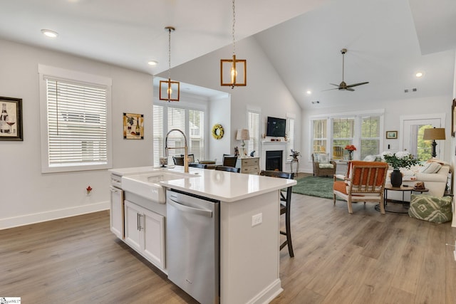 1560 Shallons Ct, Spartanburg, SC 29301 - kitchen with dishwasher, a sink, a fireplace, ceiling fan, and open floor plan