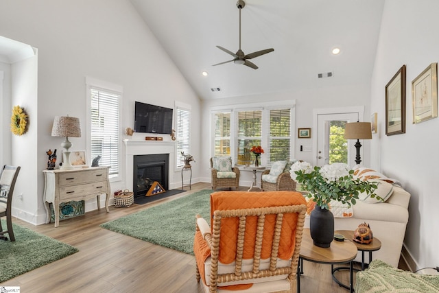 1560 Shallons Ct, Spartanburg, SC 29301 - living room featuring high vaulted ceiling, ceiling fan, a glass covered fireplace, recessed lighting, and light wood-style flooring