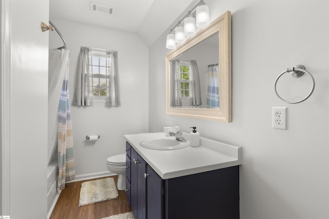 bathroom with vanity, baseboards, wood finished floors, and toilet