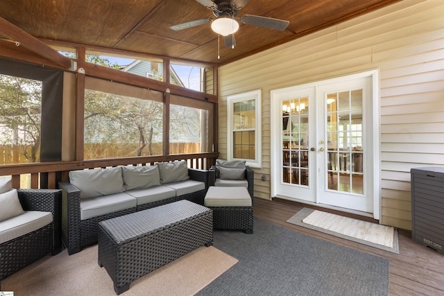 sunroom / solarium with french doors, outdoor lounge area, and ceiling fan