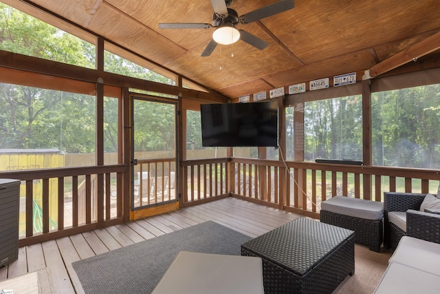 sunroom featuring ceiling fan, lofted ceiling, and healthy amount of natural light