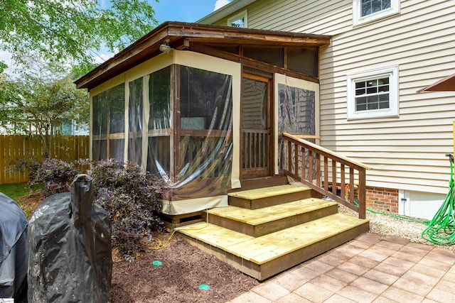 doorway to property with fence