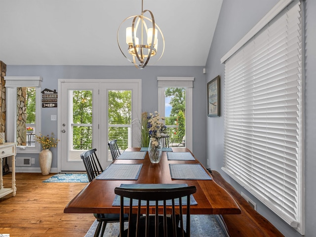 702 Lakewinds Blvd, Inman, SC 29349 - dining room featuring a chandelier, wood finished floors, healthy amount of natural light, and vaulted ceiling