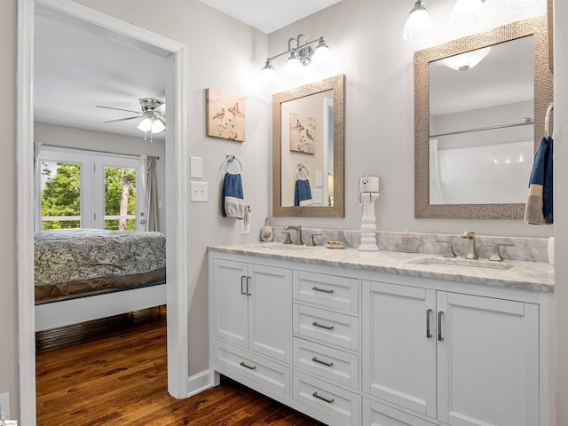 702 Lakewinds Blvd, Inman, SC 29349 - full bathroom with wood finished floors, ensuite bathroom, a ceiling fan, double vanity, and baseboards