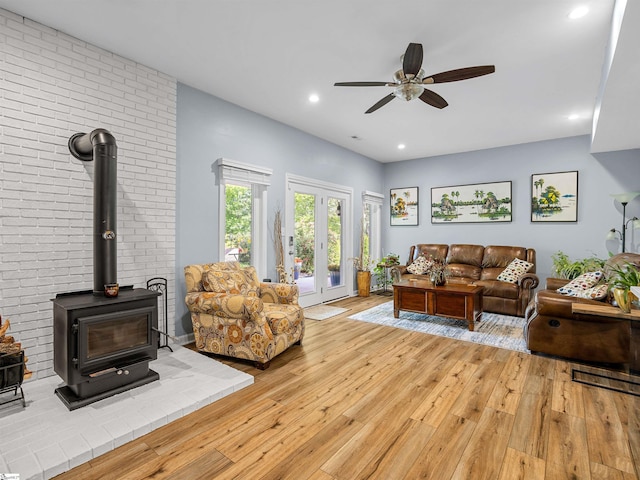 702 Lakewinds Blvd, Inman, SC 29349 - living room featuring ceiling fan, light wood-style floors, a wood stove, and recessed lighting