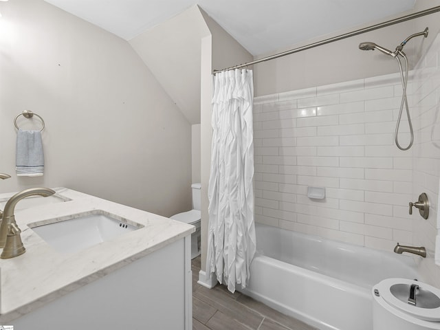 702 Lakewinds Blvd, Inman, SC 29349 - bathroom featuring toilet, shower / bath combination with curtain, wood finish floors, vanity, and lofted ceiling