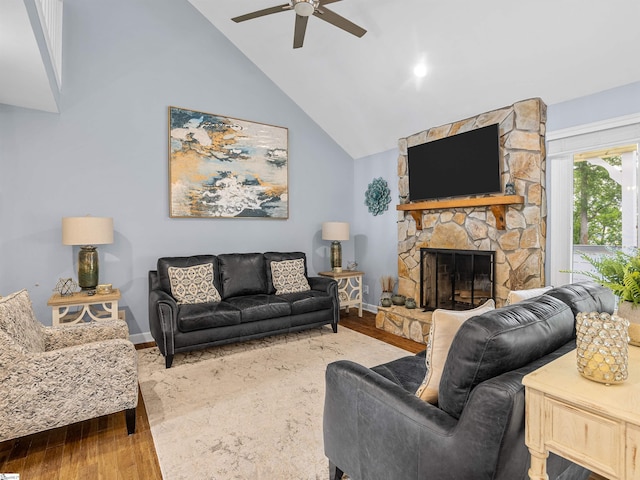702 Lakewinds Blvd, Inman, SC 29349 - living area with ceiling fan, wood finished floors, a stone fireplace, baseboards, and high vaulted ceiling