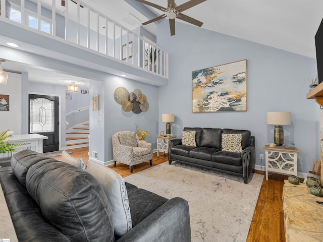 702 Lakewinds Blvd, Inman, SC 29349 - living room with wood finished floors, a ceiling fan, stairs, high vaulted ceiling, and baseboards
