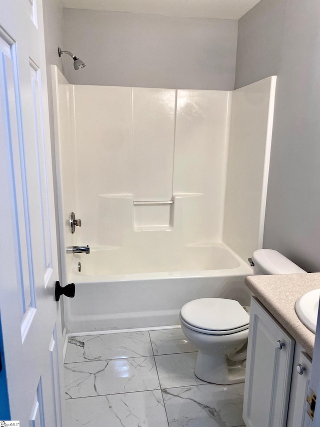 full bath with marble look tile flooring, vanity, toilet, and  shower combination