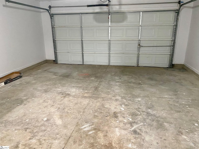 garage featuring baseboards