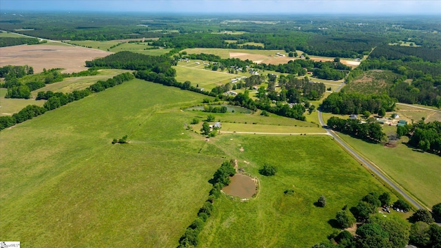 aerial view of property and surrounding area featuring rural landscape