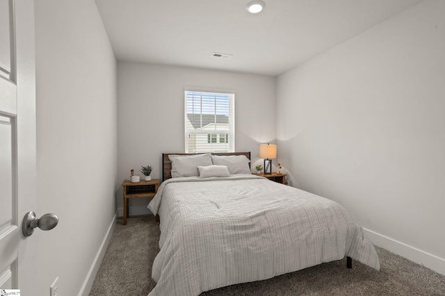 bedroom with carpet floors and baseboards
