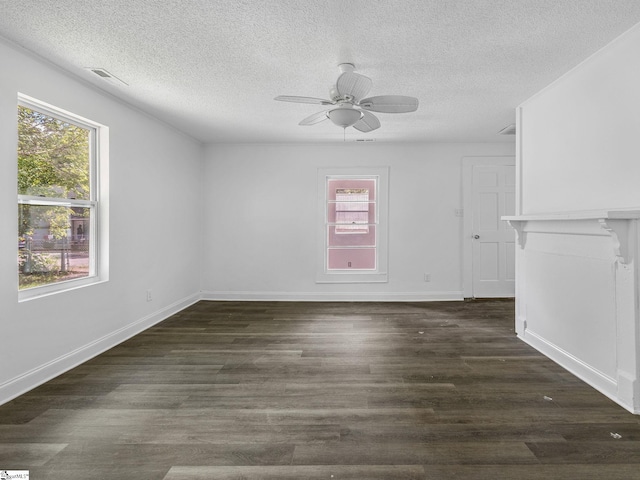 7 Williams St, Spartanburg, SC 29301 - unfurnished room featuring a textured ceiling, ceiling fan, dark wood-type flooring, and baseboards