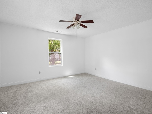 7 Williams St, Spartanburg, SC 29301 - carpeted spare room with a textured ceiling, ceiling fan, and baseboards