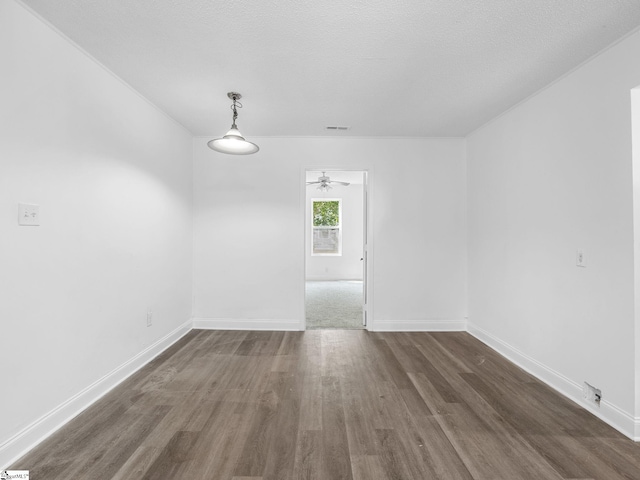 7 Williams St, Spartanburg, SC 29301 - unfurnished dining area featuring wood finished floors, a ceiling fan, and baseboards