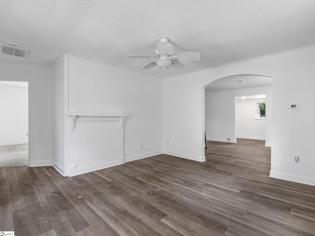7 Williams St, Spartanburg, SC 29301 - unfurnished living room featuring arched walkways, ceiling fan, dark wood-type flooring, a textured ceiling, and baseboards