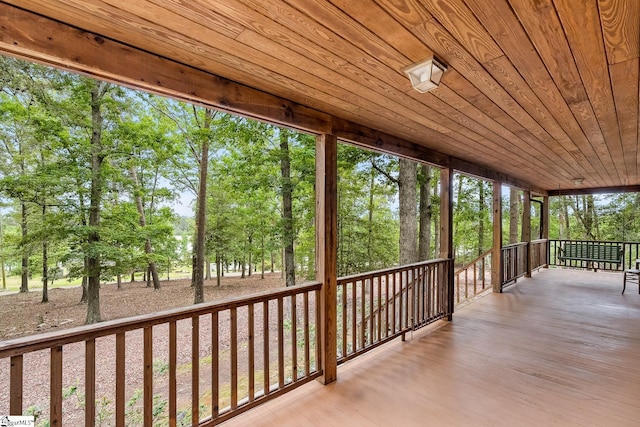 unfurnished sunroom with view of scattered trees