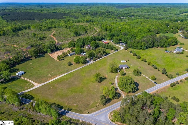 aerial overview of property's location featuring a forest