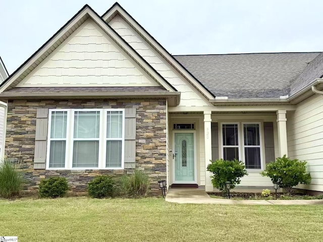 920 Hunterdale Ln, Boiling Springs, SC 29316 - view of front facade with stone siding, a front lawn, and a shingled roof