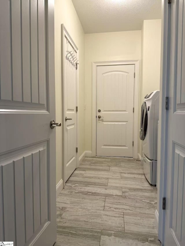 920 Hunterdale Ln, Boiling Springs, SC 29316 - clothes washing area featuring washer / clothes dryer, baseboards, and light wood-style floors