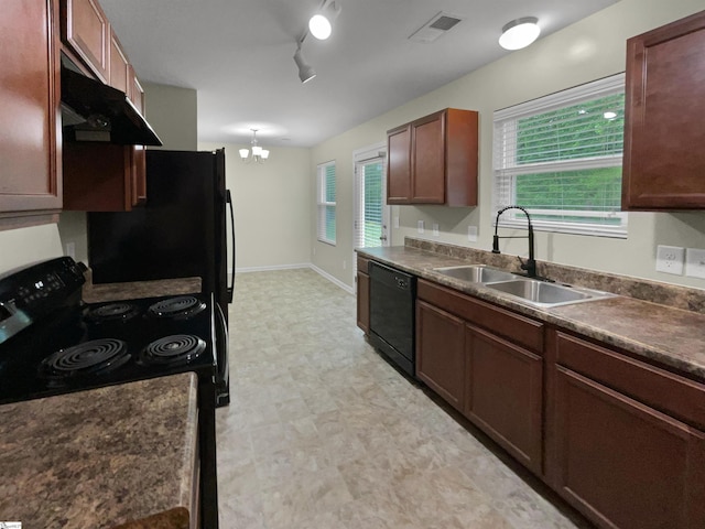135 Evvalane Dr, Spartanburg, SC 29302 - kitchen featuring black appliances, light flooring, a sink, and dark countertops