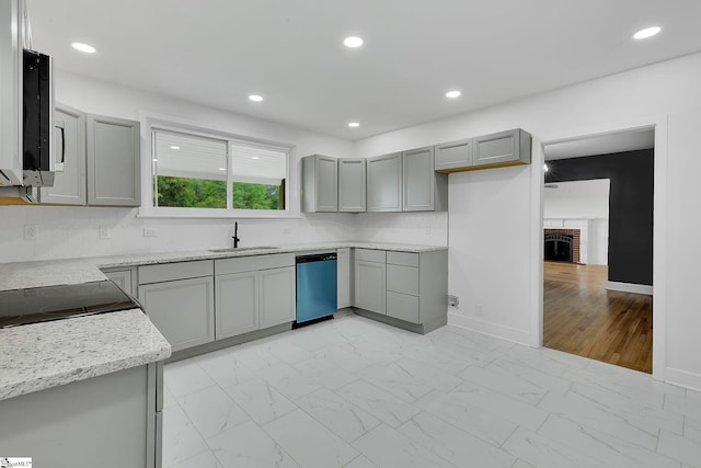 3902 Old Buncombe Rd, Greenville, SC 29617 - kitchen with dishwashing machine, gray cabinetry, a sink, baseboards, and recessed lighting