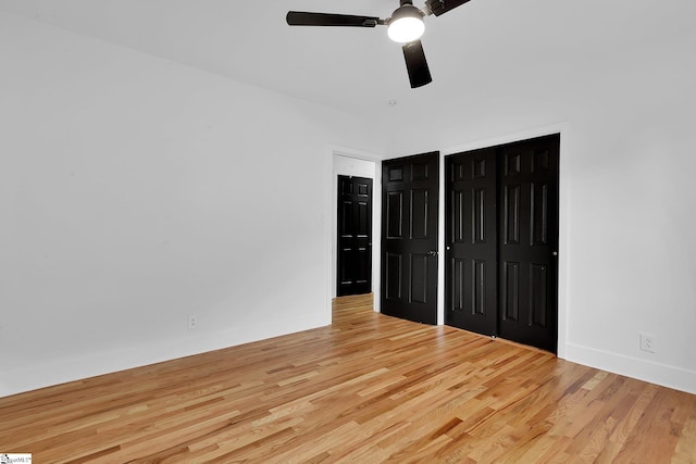 3902 Old Buncombe Rd, Greenville, SC 29617 - unfurnished bedroom featuring light wood-style flooring, a closet, a ceiling fan, and baseboards