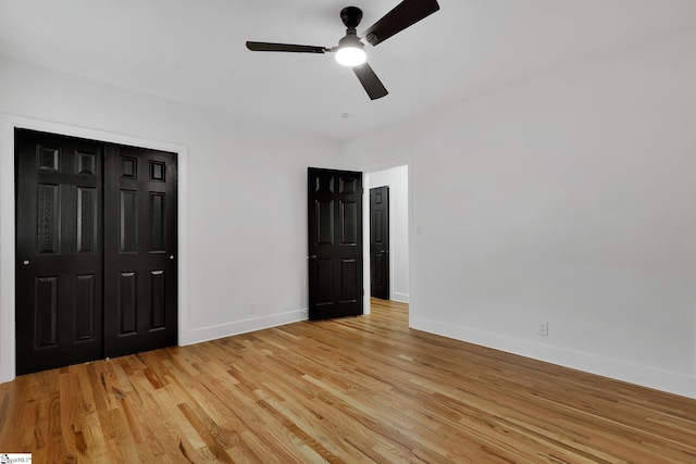 3902 Old Buncombe Rd, Greenville, SC 29617 - unfurnished bedroom with baseboards, light wood-style floors, a closet, and ceiling fan
