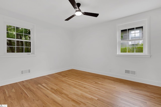 3902 Old Buncombe Rd, Greenville, SC 29617 - unfurnished room featuring healthy amount of natural light, baseboards, and light wood finished floors