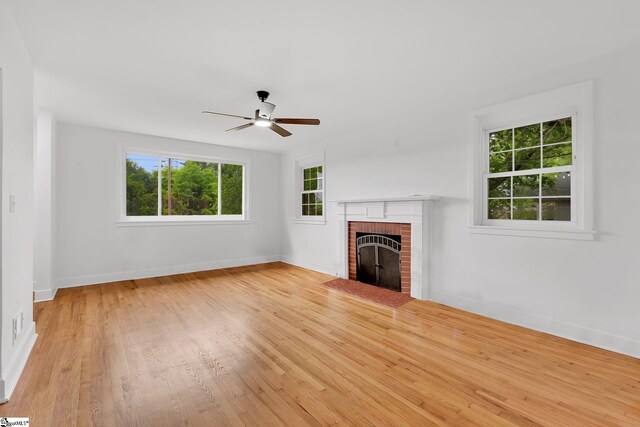 3902 Old Buncombe Rd, Greenville, SC 29617 - unfurnished living room with ceiling fan, baseboards, wood finished floors, and a fireplace