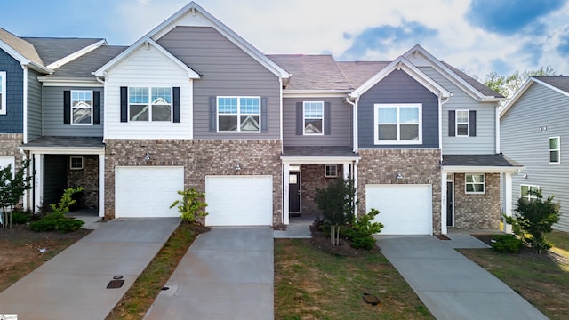 307 E Compass Way, Easley, SC 29640 - view of property with driveway, an attached garage, and brick siding